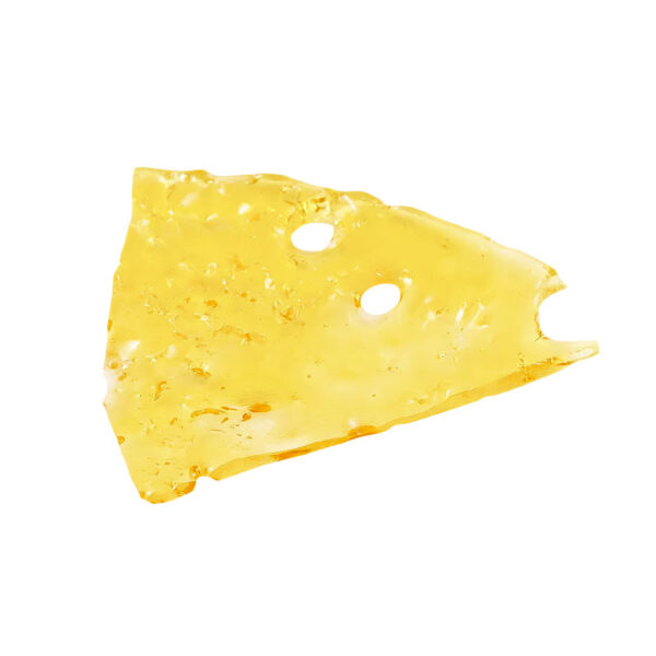 Bruce Banner shatter, a form of cannabis concentrate with yellow-amber hue and glass-like texture on white background.