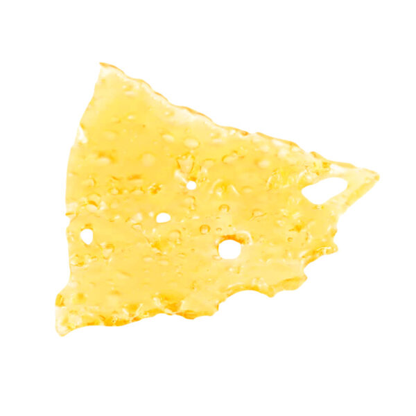 Lemon Haze shatter, a form of cannabis concentrate with yellow-amber hue and glass-like texture on white background.