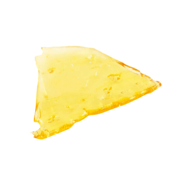 White Widow shatter, a form of cannabis concentrate with yellow-amber hue and glass-like texture on white background.